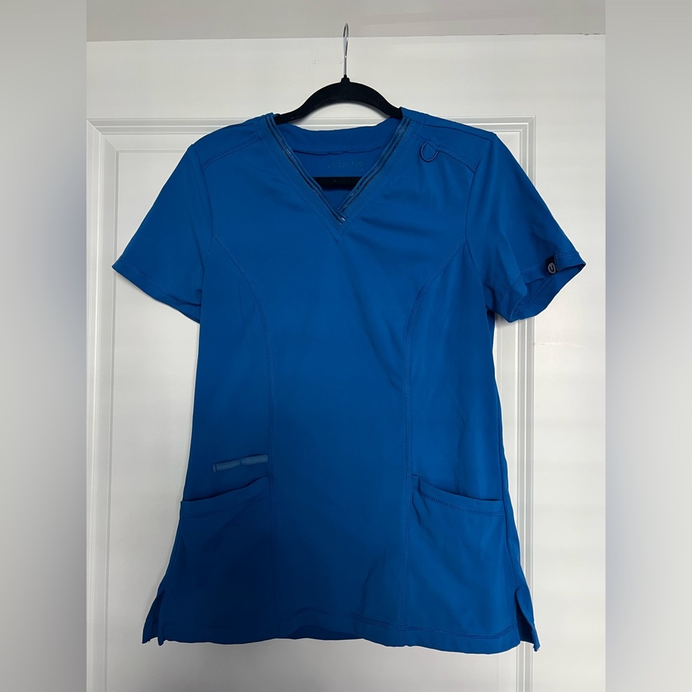 Urbane woman’s blue v neck scrub top